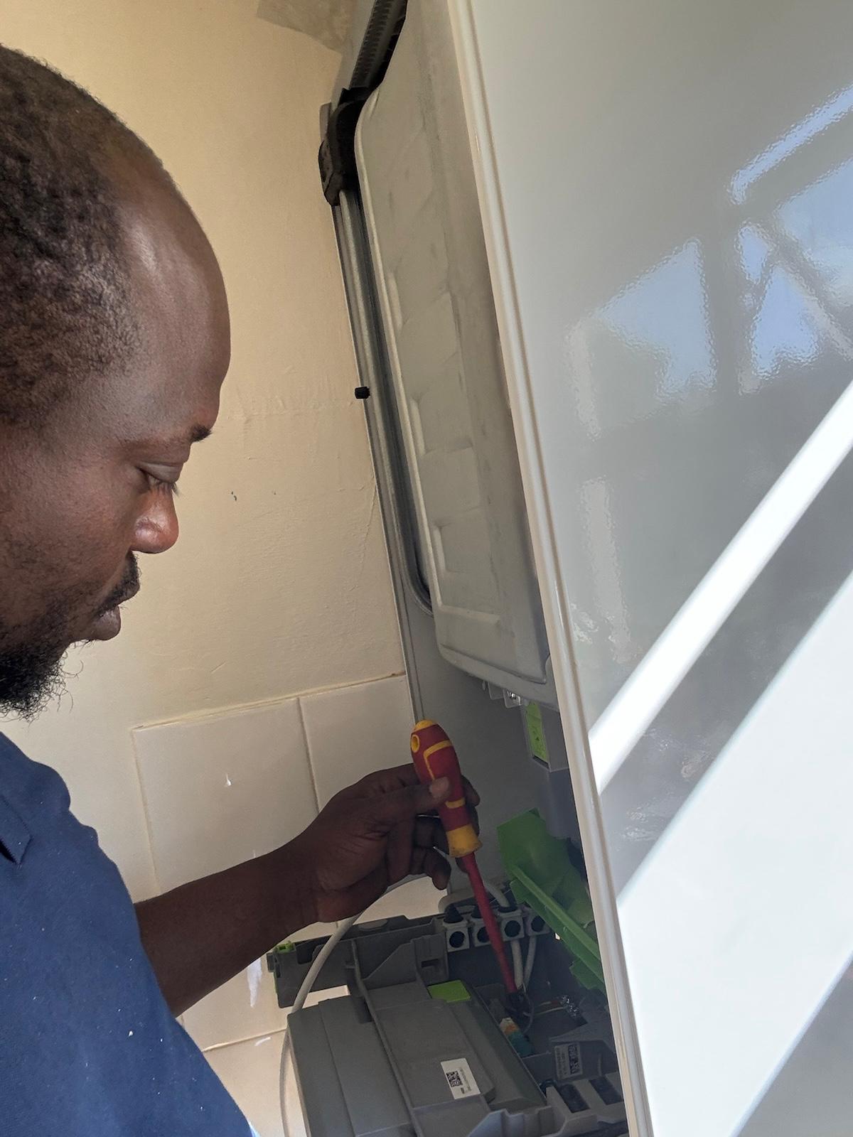 Gas Safe engineer repairing a boiler in Chatham Kent