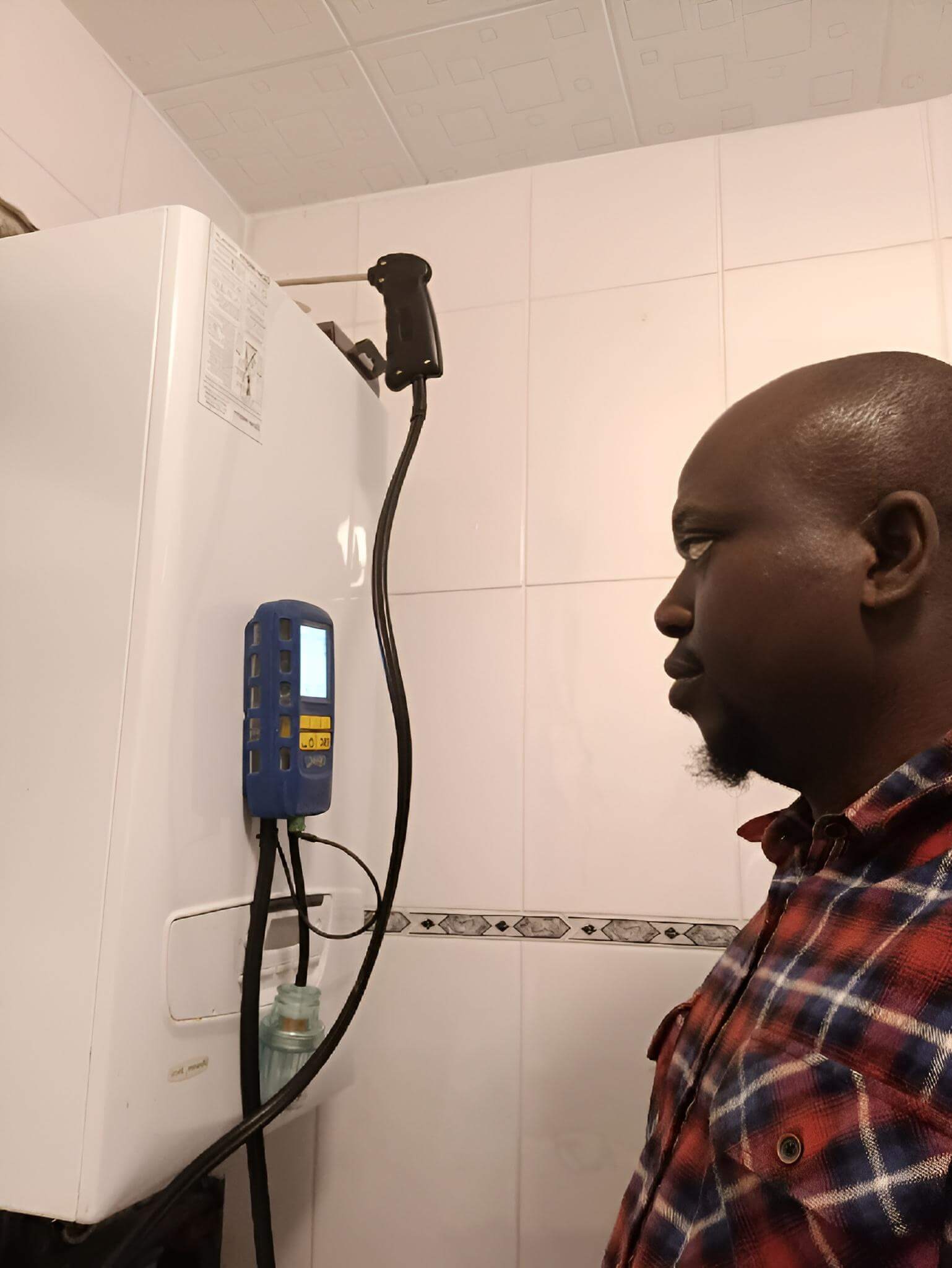 Gas Safe plumber in Chatham discussing boiler installation with client